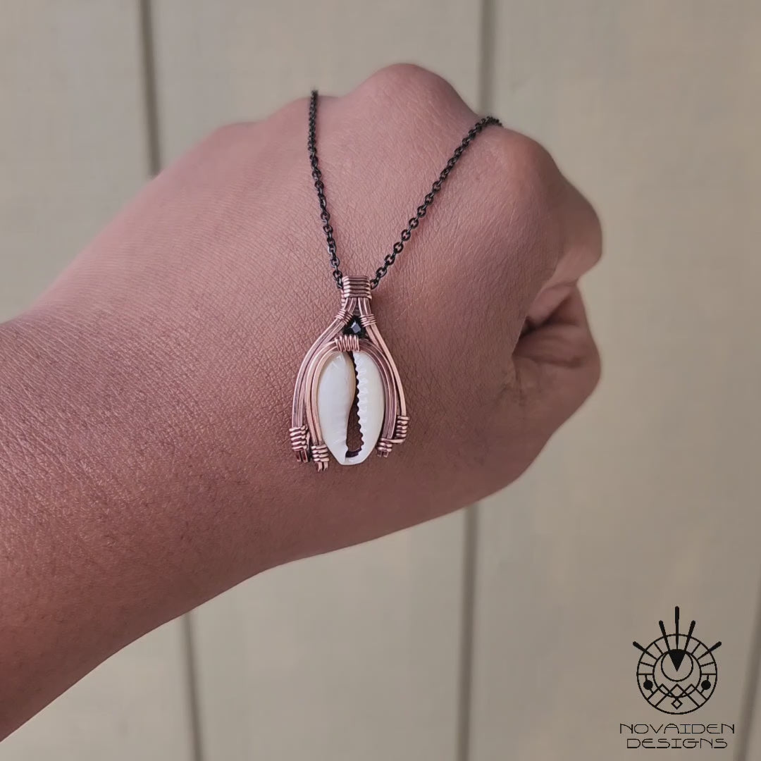Load and play video in Gallery viewer, Cowrie Shell & Black Spinel Copper Necklace