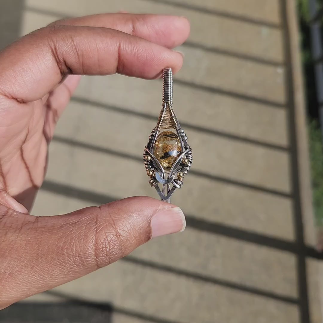 Load and play video in Gallery viewer, Golden Rutile & Hematite Quartz Pendant