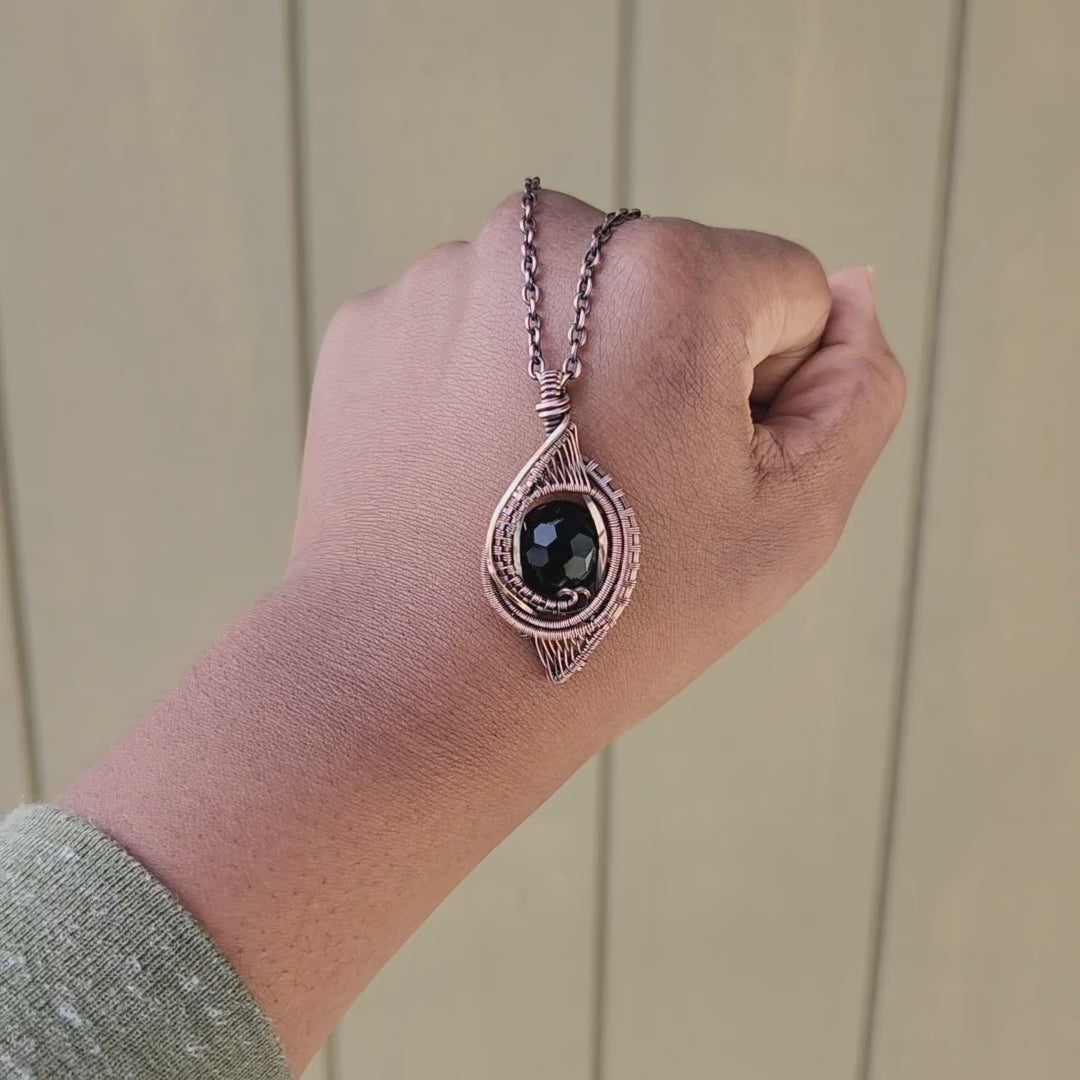 Load and play video in Gallery viewer, Soccer Facet Cut Onyx in Copper Amulet