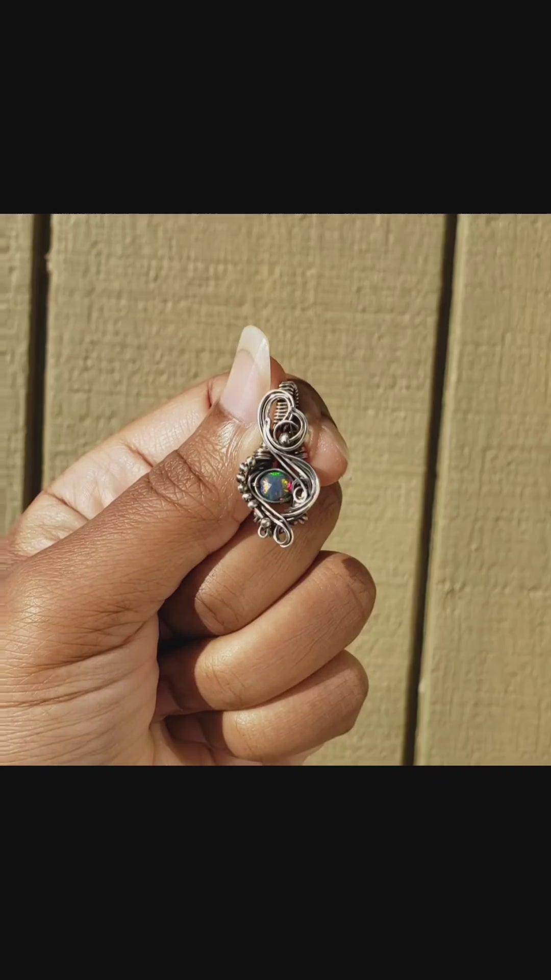 Load and play video in Gallery viewer, Faceted Black Ethiopian Opal in Sterling Silver Pendant