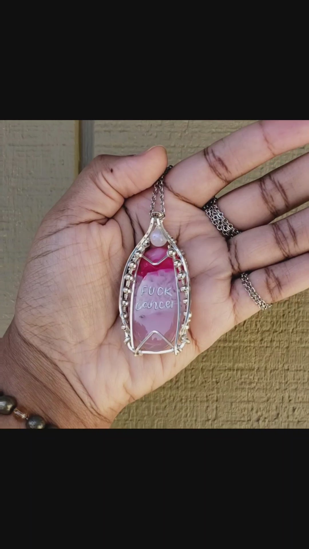 Load and play video in Gallery viewer, Sterling Silver Fuck Cancer Engraved Pink Dyed Agate Pendant
