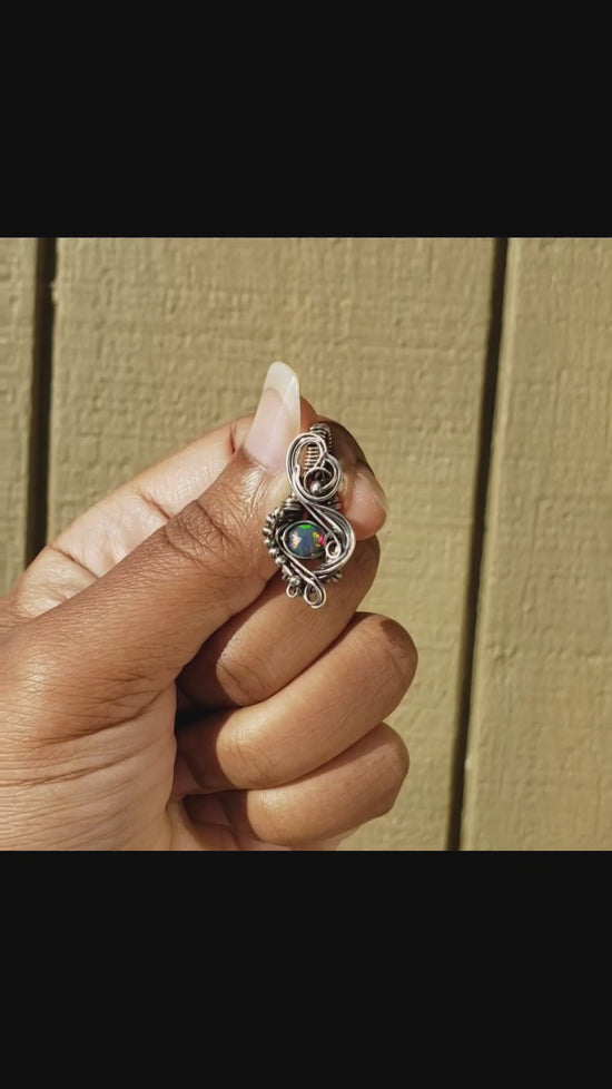 Load and play video in Gallery viewer, Faceted Black Ethiopian Opal in Sterling Silver Pendant
